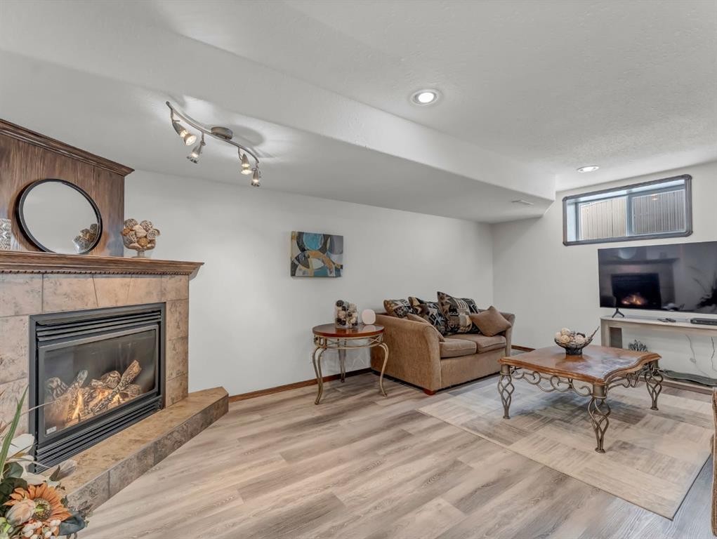 32 Sunrise Court Sw, Medicine Hat, AB - Indoor Photo Showing Living Room With Fireplace