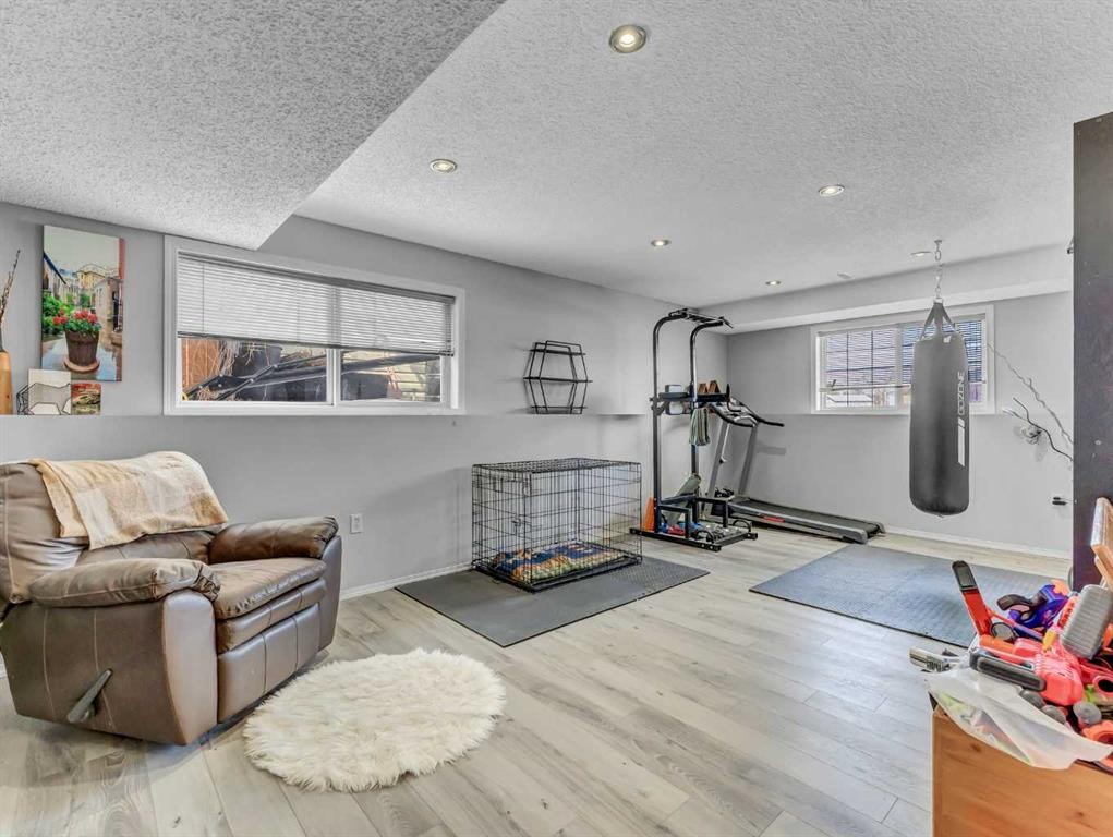 416 Redcliff Way Se, Redcliff, AB - Indoor Photo Showing Gym Room