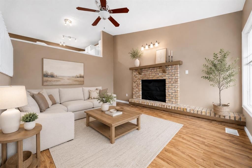 107 Sprague Way Se, Medicine Hat, AB - Indoor Photo Showing Living Room With Fireplace