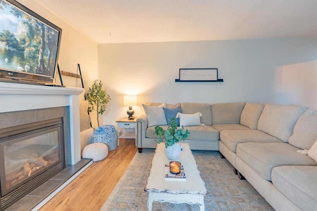 2339 20 Avenue Se, Medicine Hat, AB - Indoor Photo Showing Living Room With Fireplace