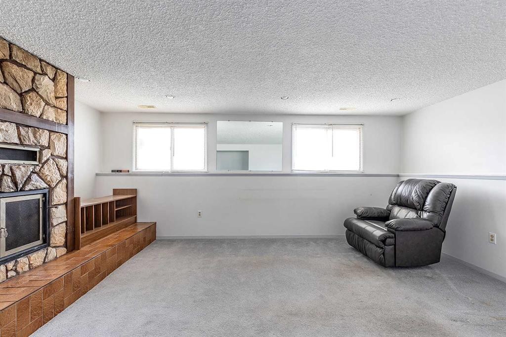 189 Hull Crescent Ne, Medicine Hat, AB - Indoor Photo Showing Other Room With Fireplace