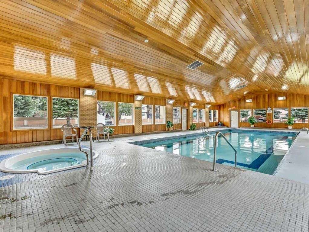 424-3021 13 Avenue Se, Medicine Hat, AB - Outdoor With In Ground Pool