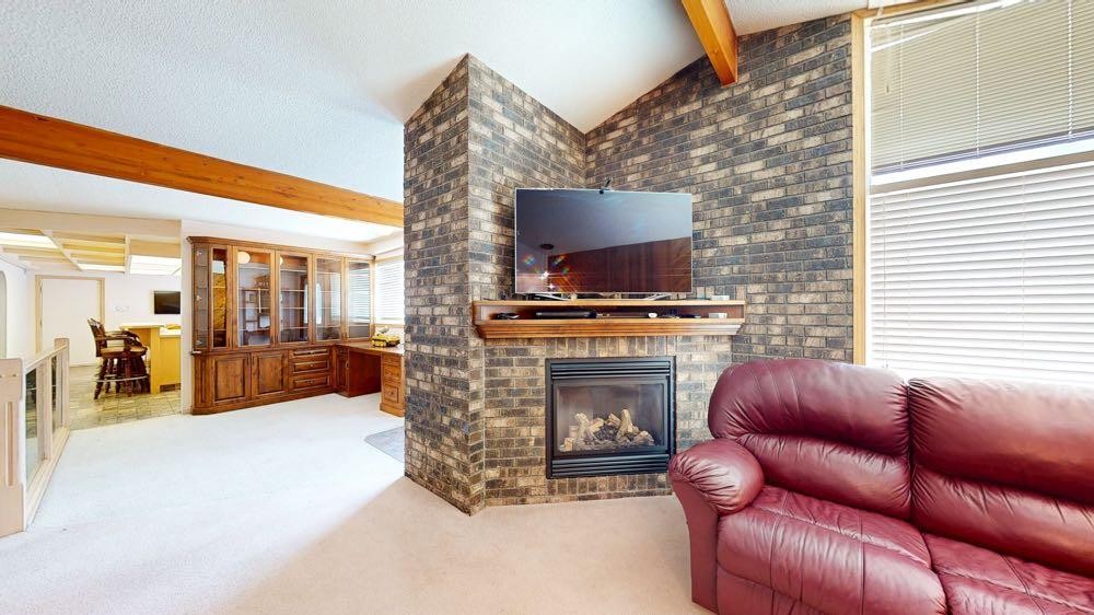 209 2 Avenue, Burdett, AB - Indoor Photo Showing Living Room With Fireplace