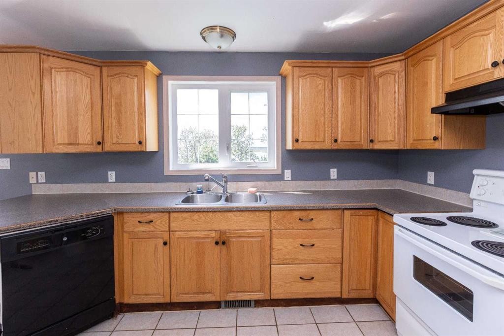 2584 Auger Road, Wabasca, AB - Indoor Photo Showing Kitchen With Double Sink