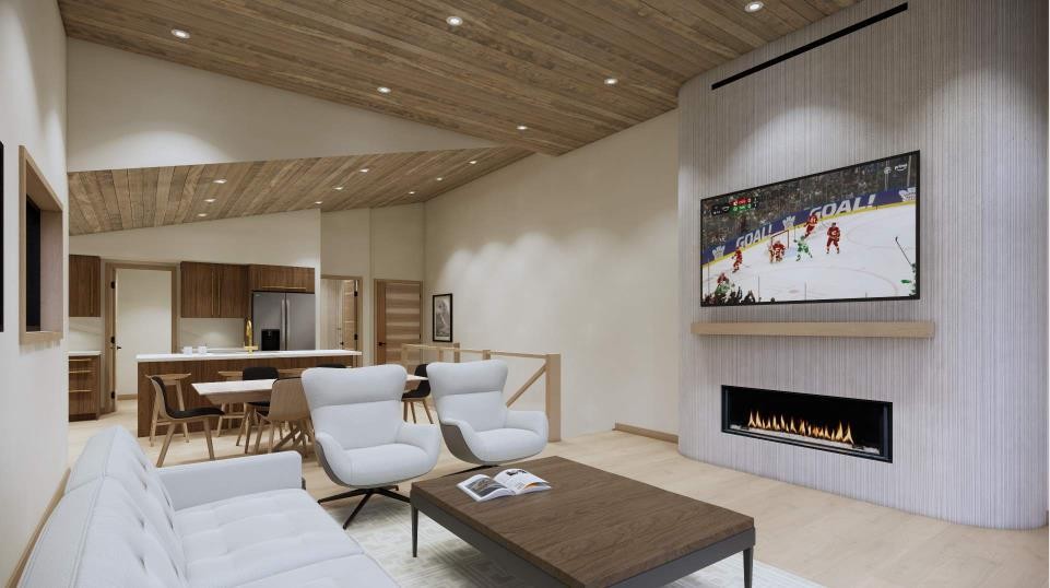 A-713 4Th Street, Canmore, AB - Indoor Photo Showing Living Room With Fireplace