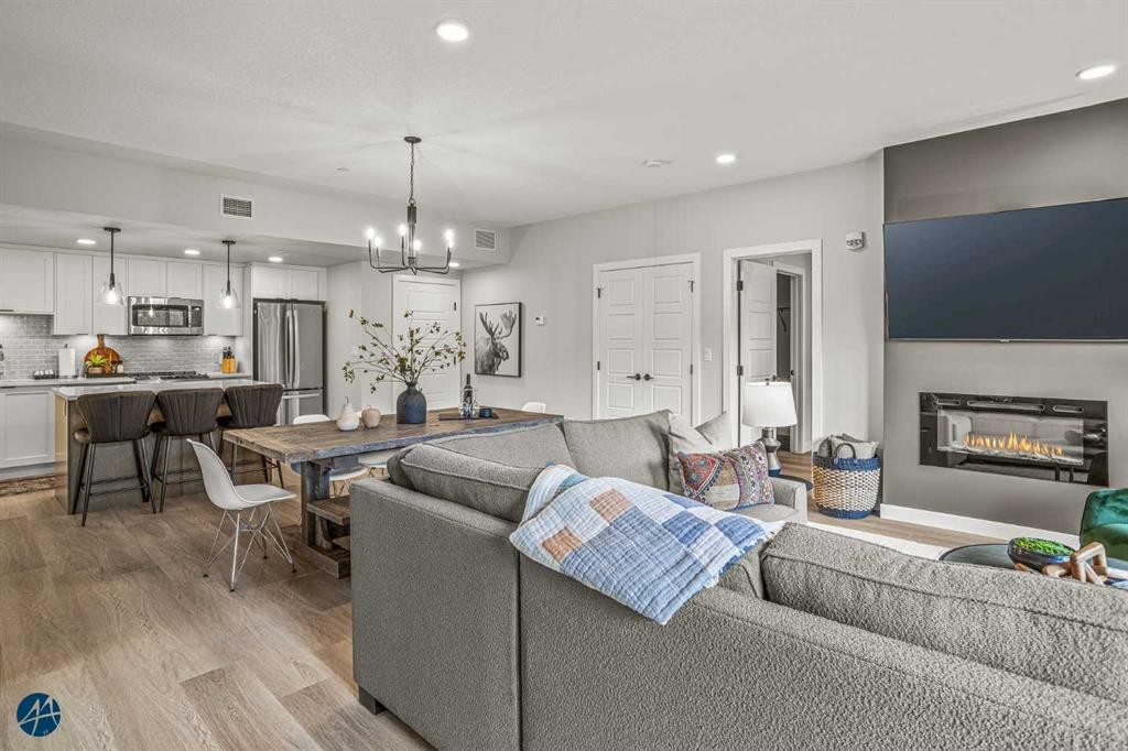 1217-200 2 Avenue, Dead Man'S Flats, AB - Indoor Photo Showing Living Room With Fireplace