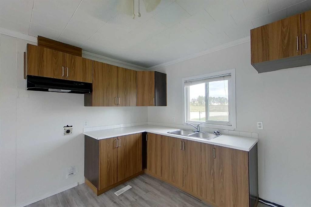 2571 Auger Road, Wabasca, AB - Indoor Photo Showing Kitchen With Double Sink