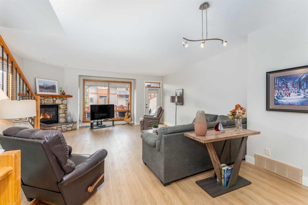 2-300 Eagle Terrace Road, Canmore, AB - Indoor Photo Showing Living Room With Fireplace