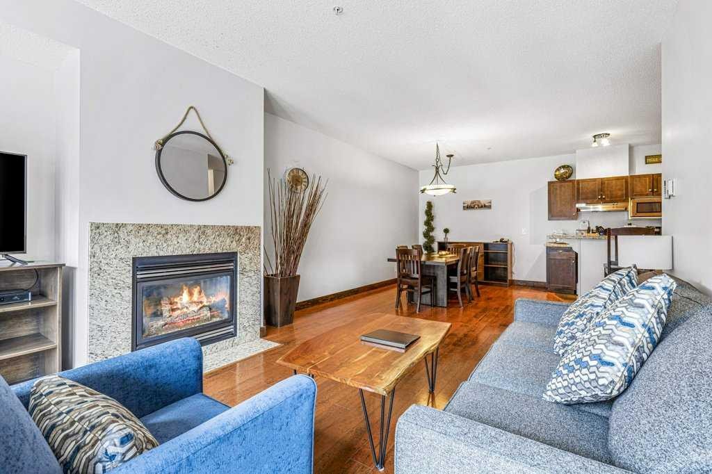 306-1151 Sidney Street, Canmore, AB - Indoor Photo Showing Living Room With Fireplace