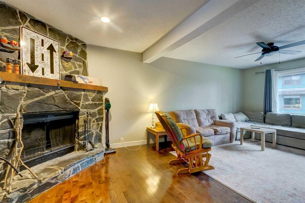 116 Nahanni Drive, Banff, AB - Indoor Photo Showing Living Room With Fireplace