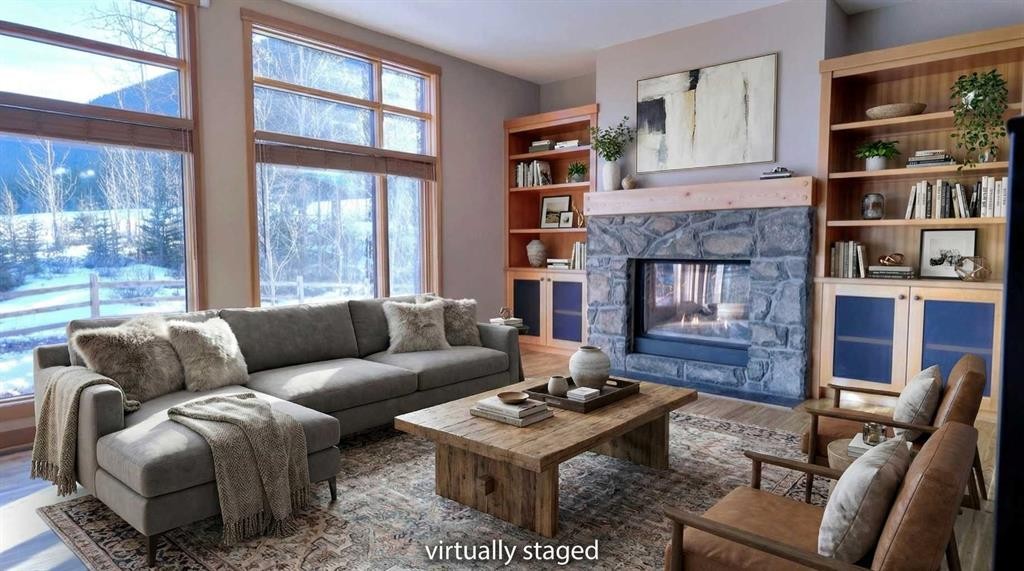 1-101 Armstrong Place, Canmore, AB - Indoor Photo Showing Living Room With Fireplace