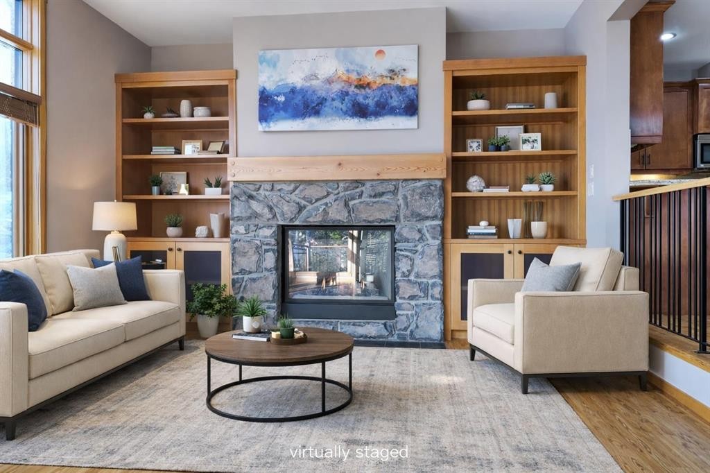 1-101 Armstrong Place, Canmore, AB - Indoor Photo Showing Living Room With Fireplace
