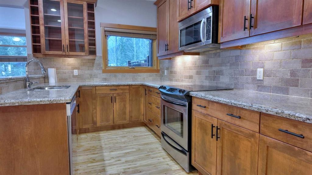 1-101 Armstrong Place, Canmore, AB - Indoor Photo Showing Kitchen With Double Sink