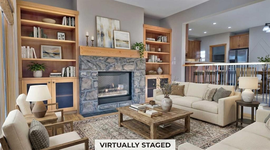 1-101 Armstrong Place, Canmore, AB - Indoor Photo Showing Living Room With Fireplace