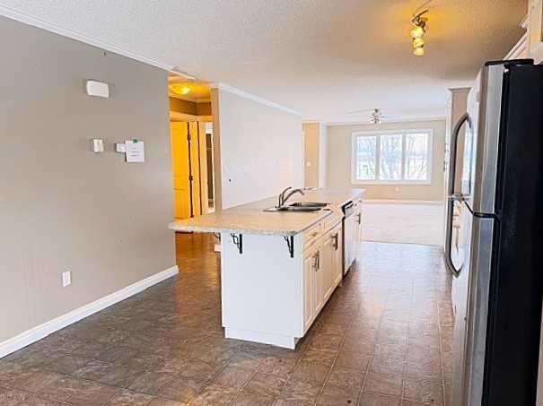 401 12 Street Sw, Slave Lake, AB - Indoor Photo Showing Kitchen With Double Sink