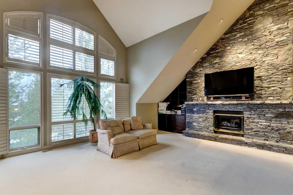 13 Antelope Lane, Banff, AB - Indoor With Fireplace