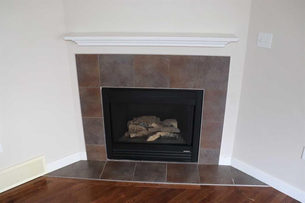2-1616 41 Street, Edson, AB - Indoor Photo Showing Living Room With Fireplace