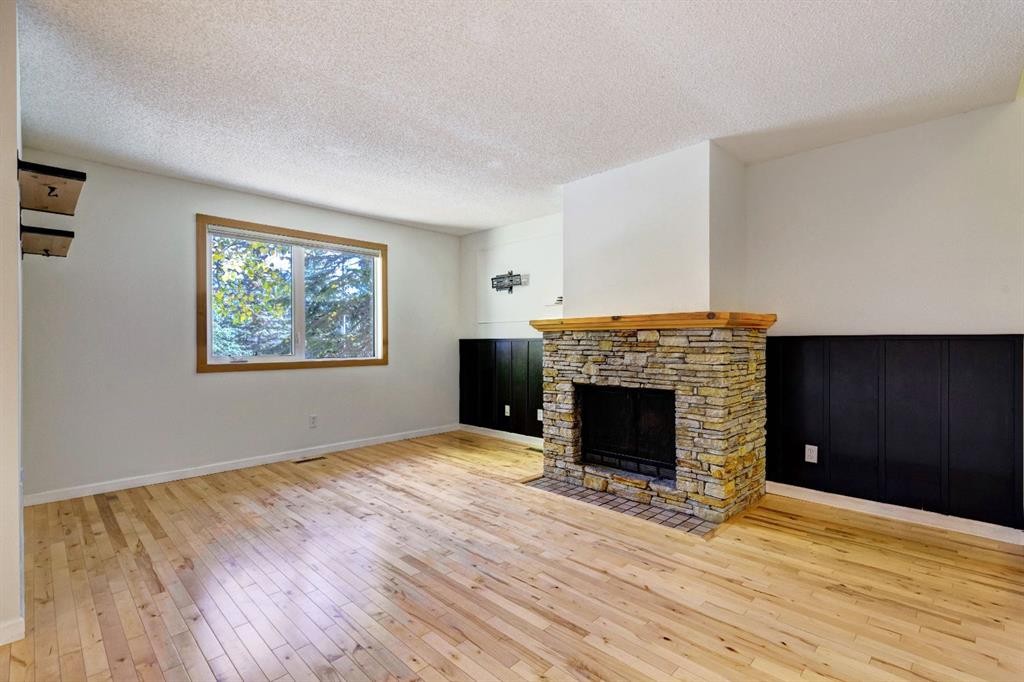 105-200 Three Sisters Drive, Canmore, AB - Indoor Photo Showing Living Room With Fireplace