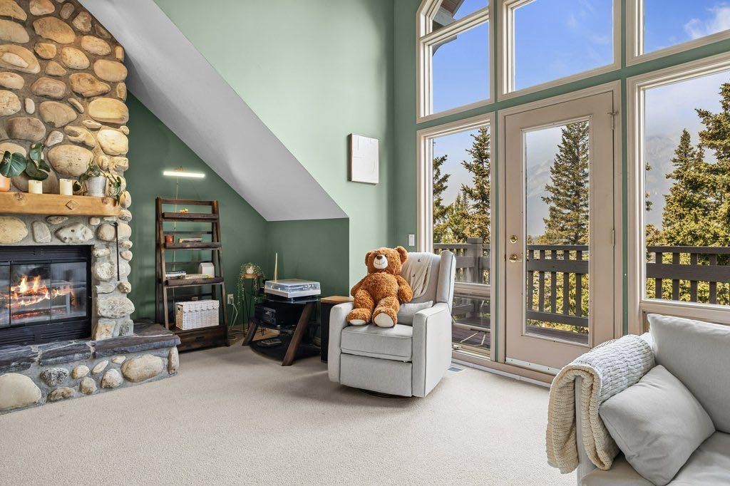 14 Antelope Lane, Banff, AB - Indoor Photo Showing Living Room With Fireplace