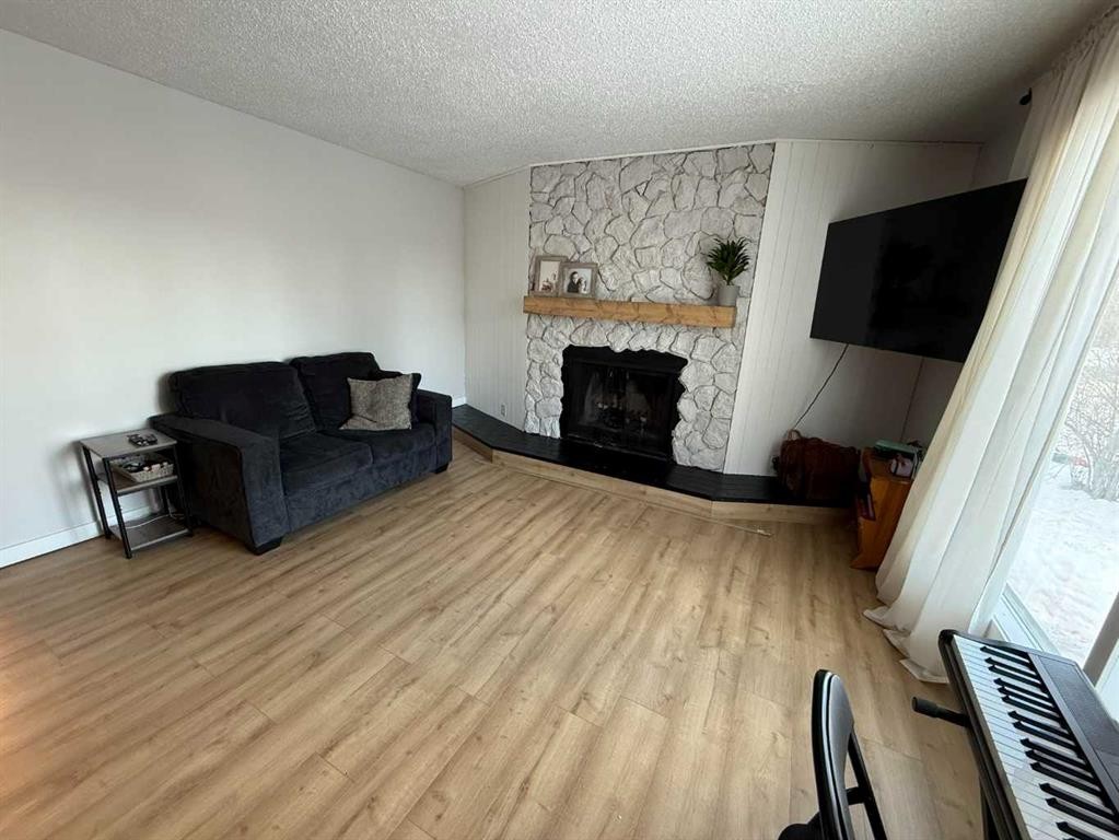 34 Wedow Drive, Whitecourt, AB - Indoor Photo Showing Living Room With Fireplace