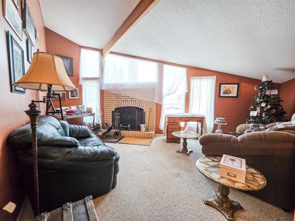 4819 10 Avenue, Edson, AB - Indoor Photo Showing Living Room With Fireplace