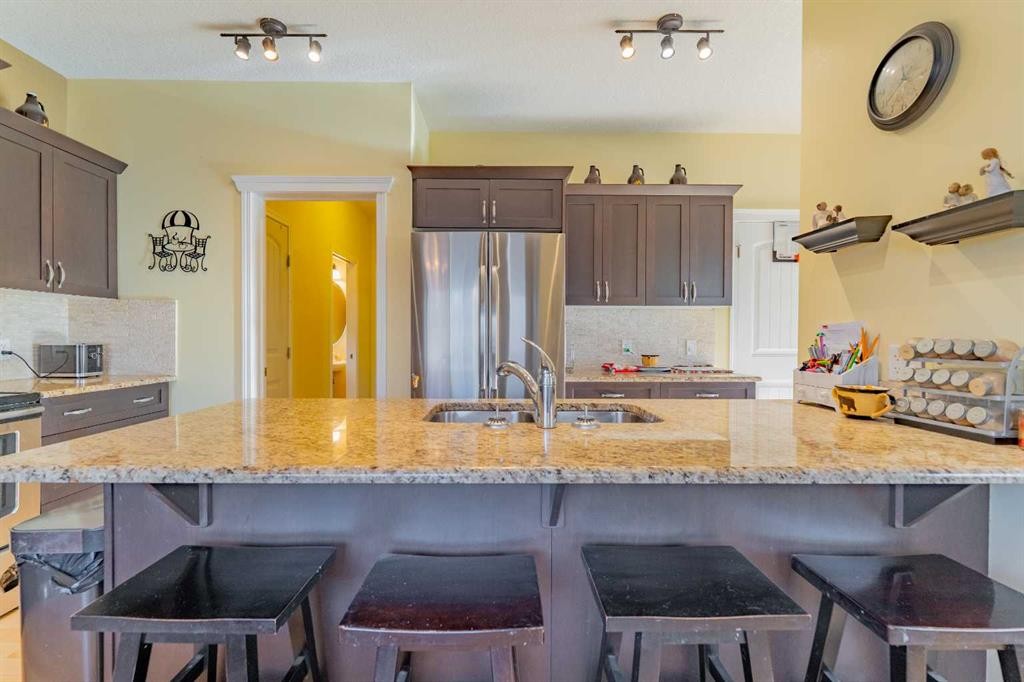 142 West Pointe Circle, Cochrane, AB - Indoor Photo Showing Kitchen With Double Sink With Upgraded Kitchen
