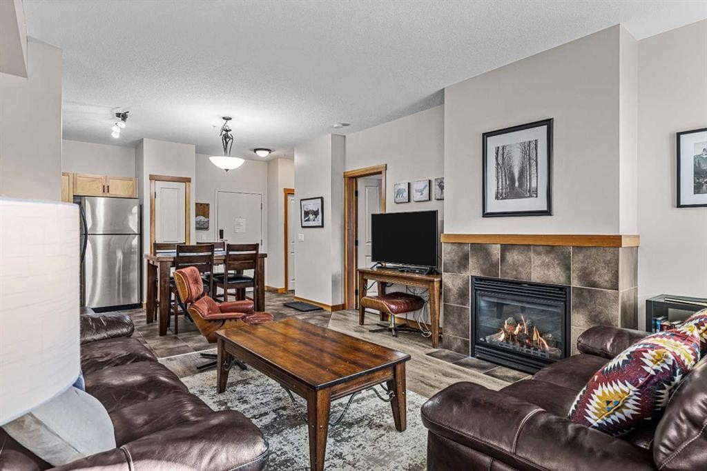 107-101 Montane Road Sw, Canmore, AB - Indoor Photo Showing Living Room With Fireplace