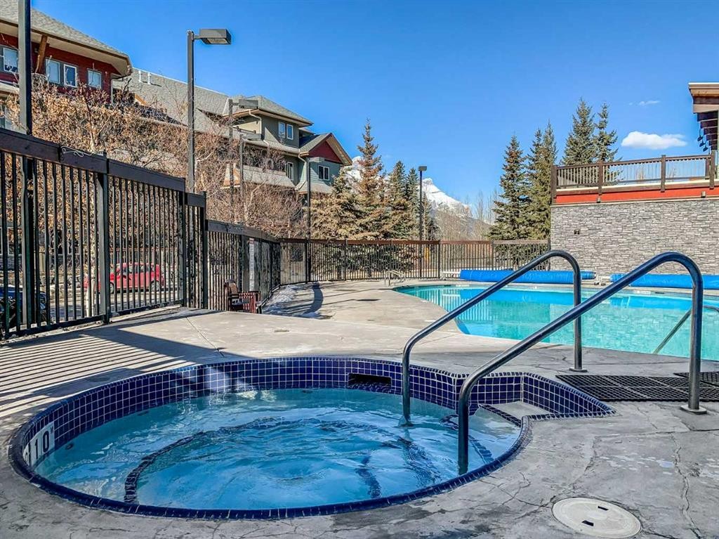 107-101 Montane Road Sw, Canmore, AB - Outdoor With In Ground Pool
