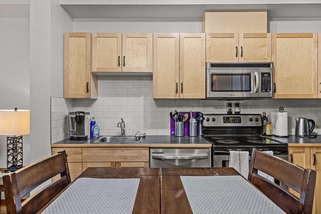 107-101 Montane Road Sw, Canmore, AB - Indoor Photo Showing Kitchen With Double Sink
