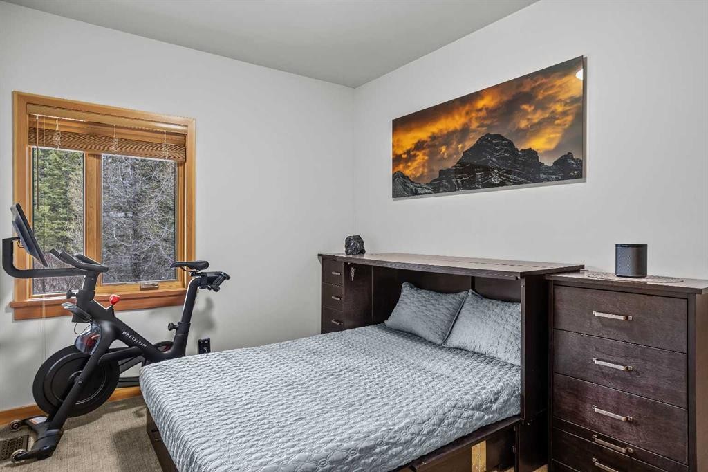 7 Creekside Mews, Canmore, AB - Indoor Photo Showing Bedroom