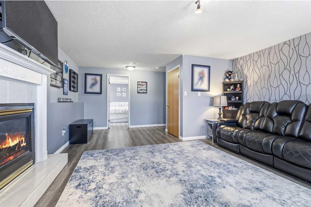 3849 55 Avenue, Whitecourt, AB - Indoor Photo Showing Living Room With Fireplace