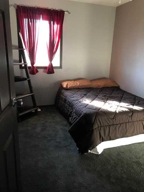 712 3 Avenue, Fox Creek, AB - Indoor Photo Showing Bedroom