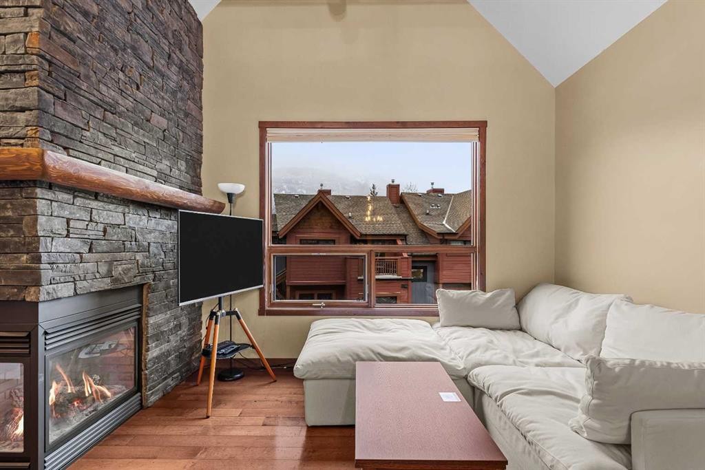623-80 Dyrgas Gate, Canmore, AB - Indoor Photo Showing Living Room With Fireplace