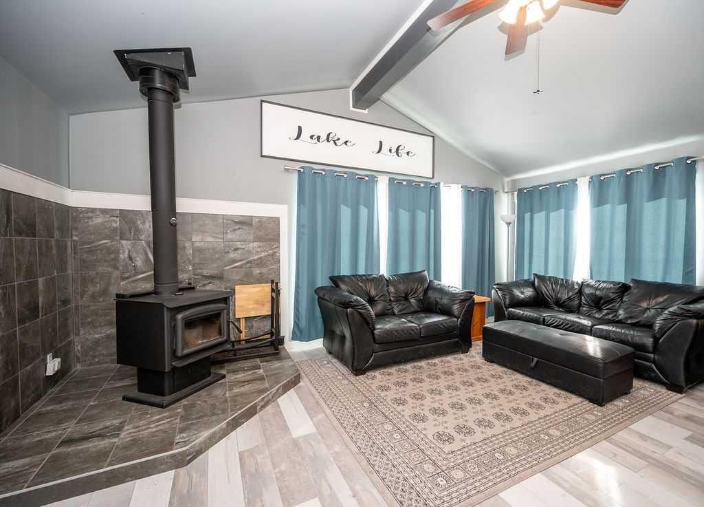 437 Sunset Road, Rural Athabasca County, AB - Indoor Photo Showing Other Room With Fireplace