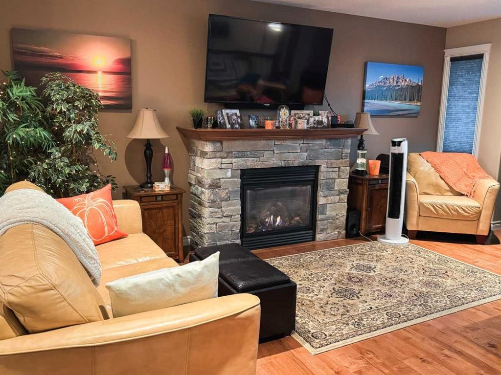 845 12 Street Se, Slave Lake, AB - Indoor Photo Showing Living Room With Fireplace