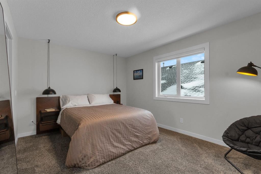 2-729 7Th, Canmore, AB - Indoor Photo Showing Bedroom