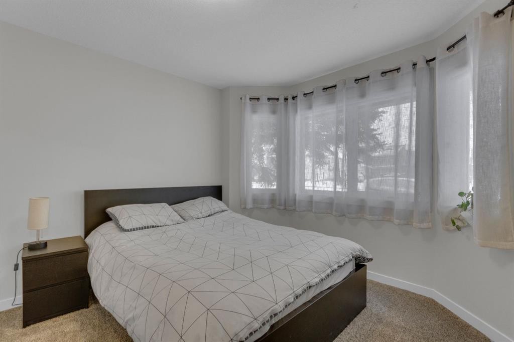 2-729 7Th, Canmore, AB - Indoor Photo Showing Bedroom
