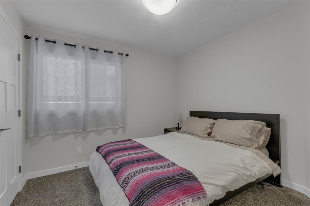 2-729 7Th, Canmore, AB - Indoor Photo Showing Bedroom