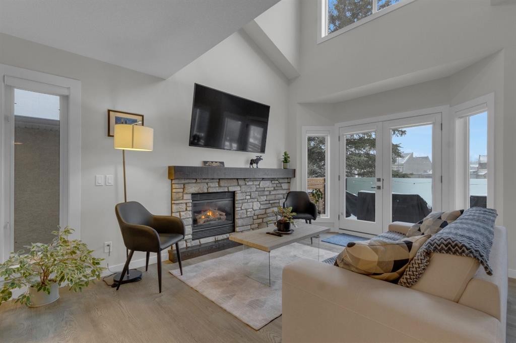 2-729 7Th, Canmore, AB - Indoor Photo Showing Living Room With Fireplace