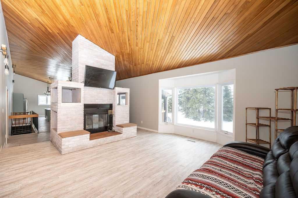 203039 Township Road 662, Rural Athabasca County, AB - Indoor Photo Showing Living Room With Fireplace