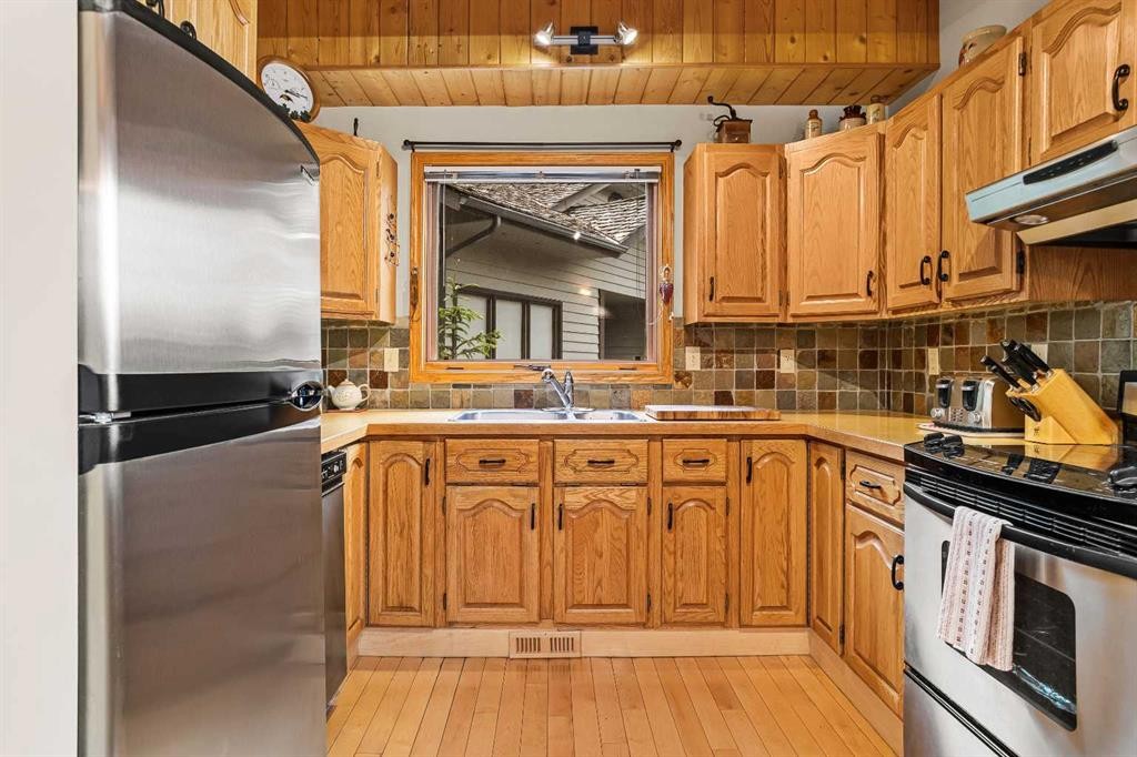 204 Grassi Place, Canmore, AB - Indoor Photo Showing Kitchen With Double Sink