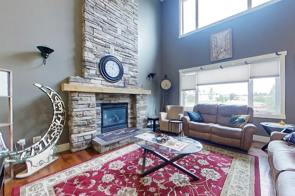 10 Parkdale Way Se, Slave Lake, AB - Indoor Photo Showing Living Room With Fireplace