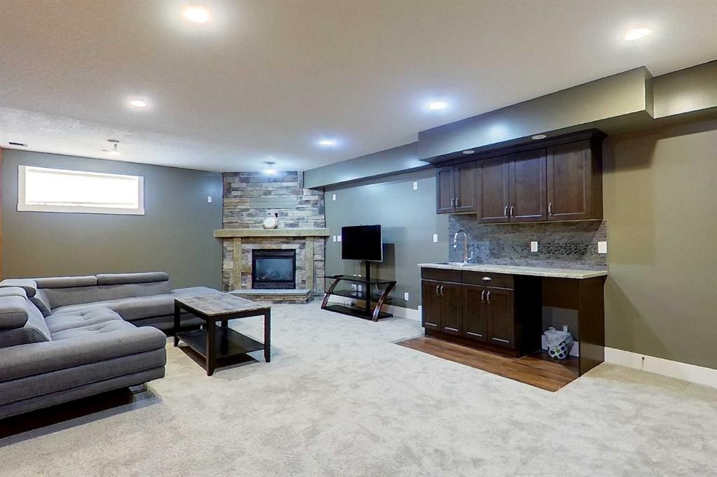 10 Parkdale Way Se, Slave Lake, AB - Indoor Photo Showing Basement With Fireplace