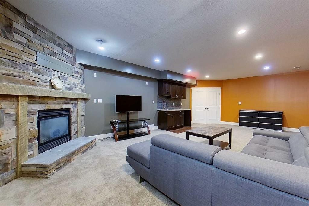 10 Parkdale Way Se, Slave Lake, AB - Indoor Photo Showing Living Room With Fireplace