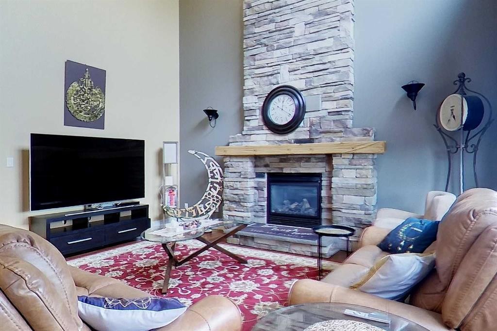 10 Parkdale Way Se, Slave Lake, AB - Indoor Photo Showing Living Room With Fireplace