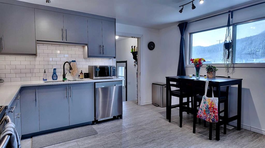 23 Mt Allen Drive, Exshaw, AB - Indoor Photo Showing Kitchen With Double Sink