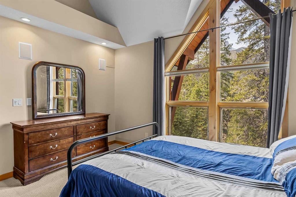 302-2100A Stewart Creek Drive, Canmore, AB - Indoor Photo Showing Bedroom