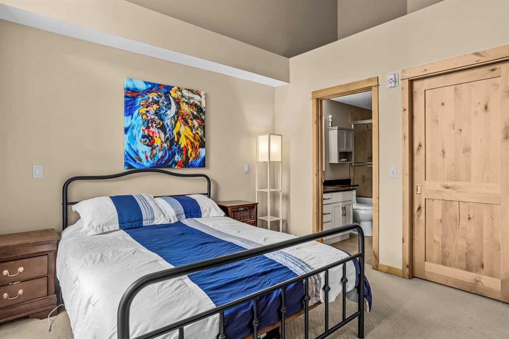 302-2100A Stewart Creek Drive, Canmore, AB - Indoor Photo Showing Bedroom