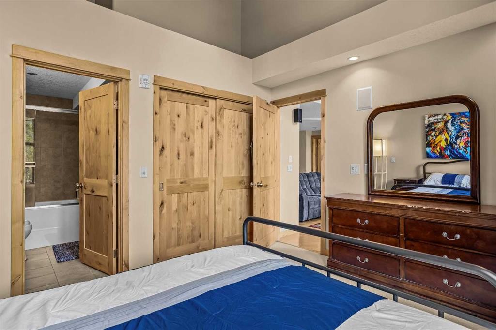 302-2100A Stewart Creek Drive, Canmore, AB - Indoor Photo Showing Bedroom