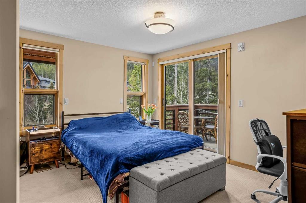 302-2100A Stewart Creek Drive, Canmore, AB - Indoor Photo Showing Bedroom